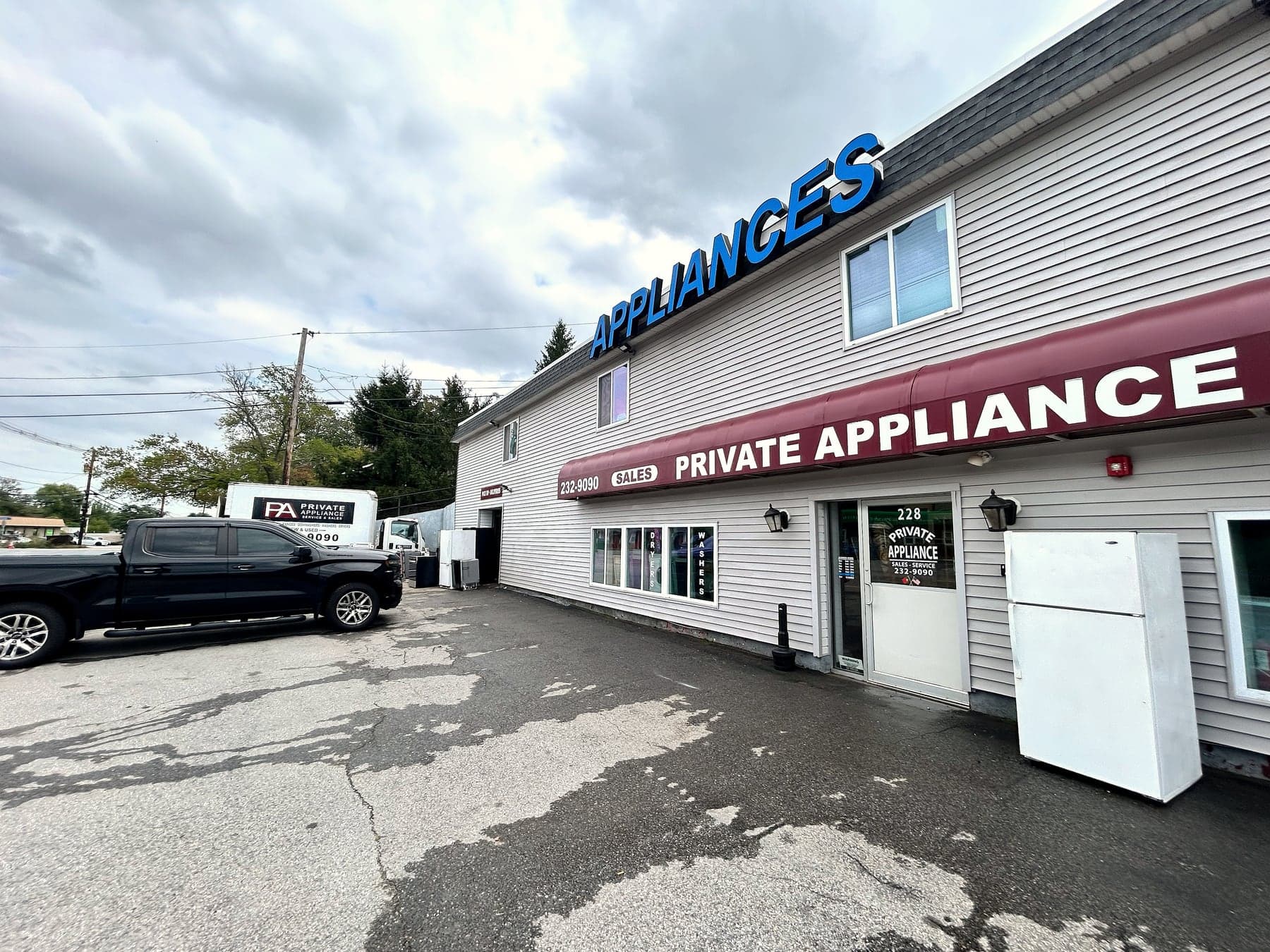 The Private Appliance box truck parked beside the store