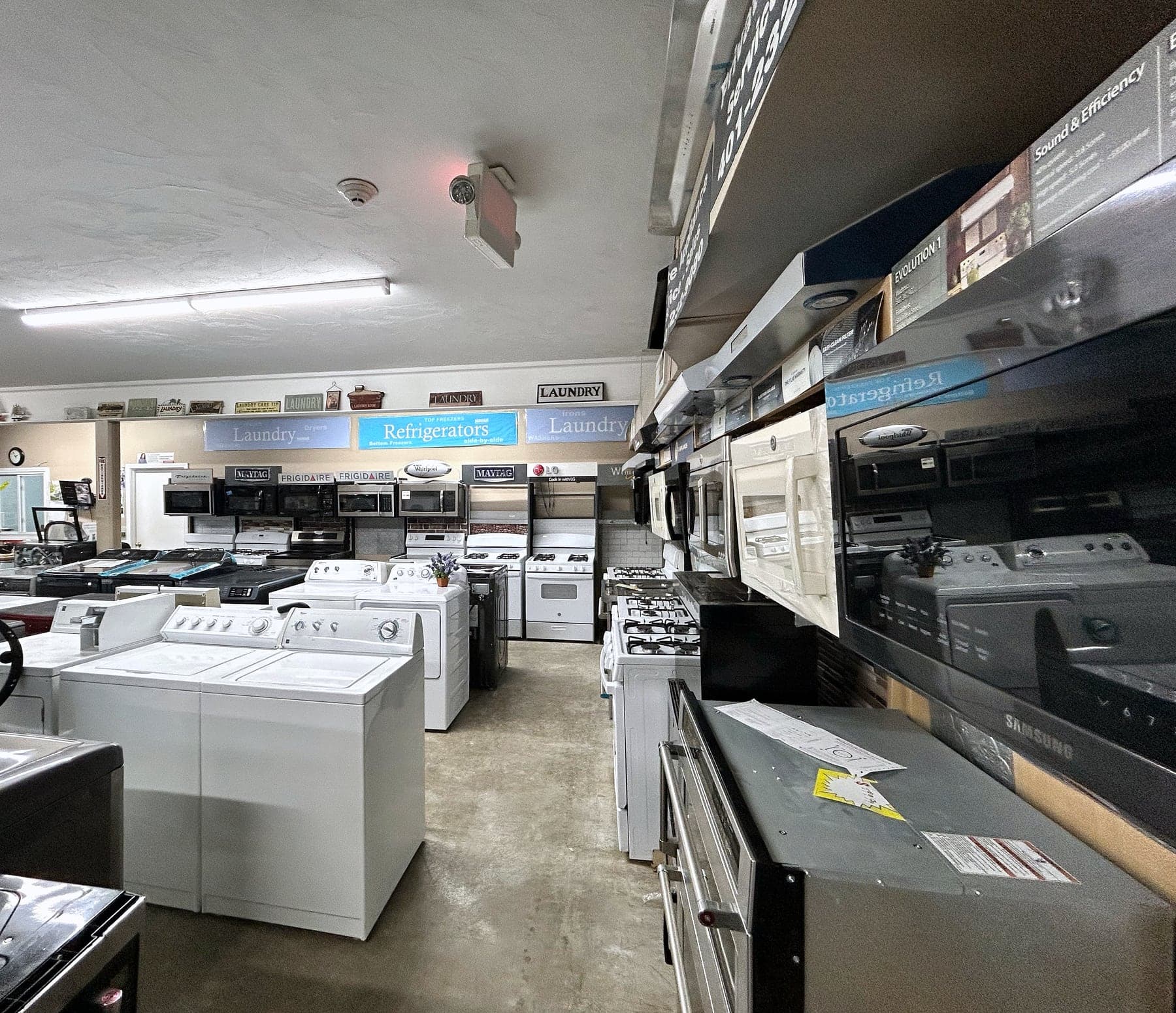 The Private Appliance showroom floor, ranges and over-the-range microwaves along the aisle